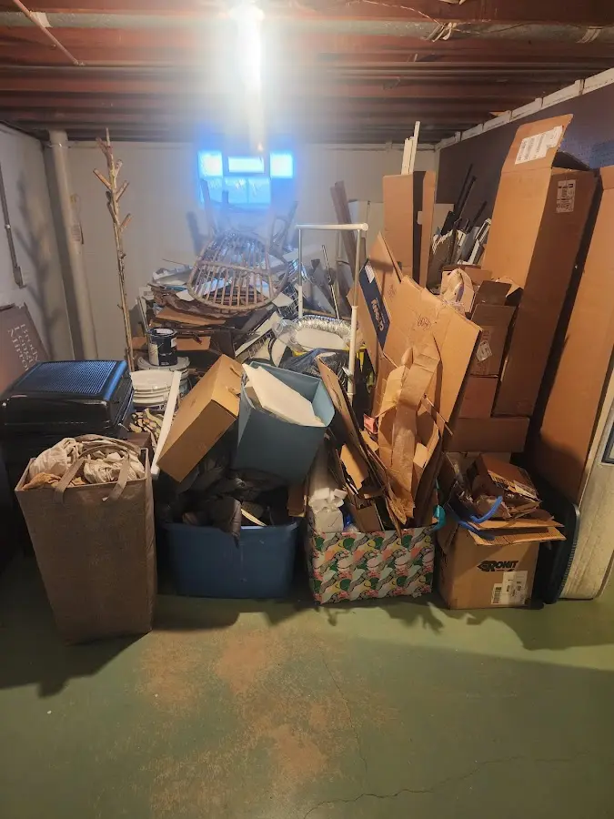 Roll-off dumpster container at job site for 8 Yard Dumpster Rental in Holliston