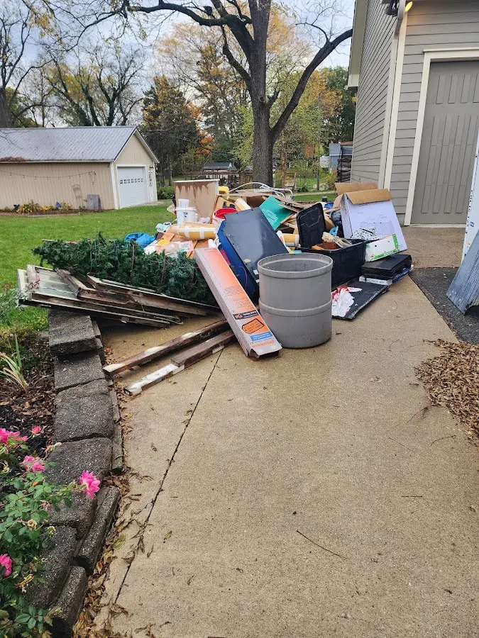 Dumpster being loaded with debris for 3 Yard Dumpster Rental in Holliston